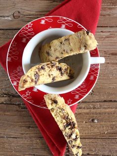 chocolate chip biscuits in a bowl on a red and white plate