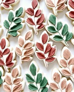 decorated cookies with leaves and berries on them