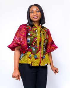 African print, peplum top. Can be worn on any pants or skirts. Fancy front zip. Elbow length puff sleeve lined with burgundy chiffon fabric. Fully lined with skin friendly lining. Short Sleeve Patchwork Tops For Party, Party Tops With Patchwork And Short Sleeves, Fitted Multicolor Blouse With Balloon Sleeves, Patchwork Short Sleeve Tops For Party, Multicolor Fitted Blouse With Balloon Sleeves, Fitted Multicolor Balloon Sleeve Blouse, Party Patchwork Short Sleeve Tops, Fall Blouse With Blouson Short Sleeves, Fall Blouse With Blouson Sleeves And Short Sleeve