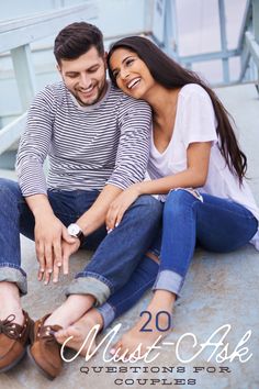 a man and woman sitting on the ground together