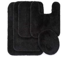 four black rugs and two oven mitts on a white background