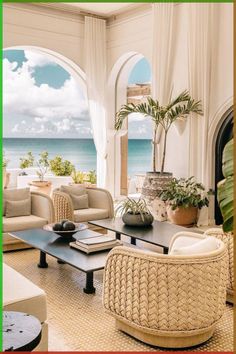 a living room with wicker furniture and an ocean view is featured in this image