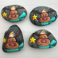 four painted rocks with animals on them and stars in the middle one has a star