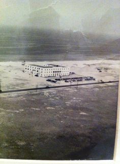 an aerial view of a building in the middle of nowhere