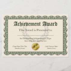 an achievement award certificate on a marble surface with gold and green trimmings,