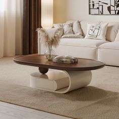 a living room with a couch, coffee table and white sofa in the background on carpeted flooring