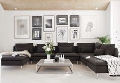 a living room filled with black and white furniture