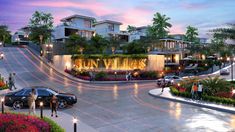 an artist's rendering of the entrance to sun vistas at dusk with cars parked in front