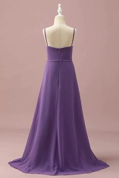 a purple dress on a mannequin dummy with the back cut out and straps down