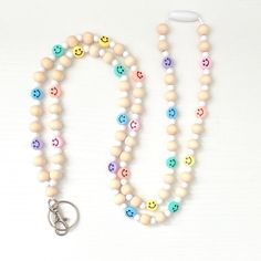 Introducing our Rainbow Beaded Lanyard - the perfect accessory to brighten up your everyday life while keeping your essentials securely at your fingertips. This lightweight lanyard combines the soothing tones of pastel colors with the magic of rainbows in a beautiful beaded design, designed to bring a touch of positivity to your wardrobe. Our Lanyard is expertly handcrafted with high-quality glass beads in a mesmerizing array of pastel hues that seamlessly blend together to create a soft and cap White Round Beaded Necklaces For Everyday, Everyday Colorful Beaded Necklaces, Multicolor Beaded Necklaces With Round Beads For Everyday, Everyday Beaded Necklaces With Round Beads, Multicolor Round Beaded Necklaces For Everyday, White Lanyard With Colorful Beads As Gift, Cheap Everyday Beaded Lanyards, Adjustable Beaded White Craft Supplies, Cheap Multicolor Beaded Lanyards