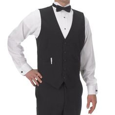 Affordable, stylish, and professional, this Henry Segal men's black basic server vest is the perfect way to complete your staff's uniforms. This vest makes it easy to ensure sophisticated uniformity in your high-end restaurant, banquet hall, casino, or catering operation. This vest is fully lined and tailored specifically for men so your staff always look their best. It also has a full cloth back for a polished, professional look and a five-button front with matching colored buttons for a stylis Bartender Uniform Men, Tuxedo Style Business Vest Sleeveless, Sleeveless Tuxedo Vest For Business, Bartender Outfit, Tuxedo Shirt Men, Staff Uniforms, Mens Casual Dress Outfits, Movie Fashion, Men In Uniform