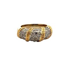 The Diamond Dome Ring with Rope Design is a striking piece that combines elegance and craftsmanship. Featuring a dome-shaped setting encrusted with 59 sparkling round brilliant cut diamonds, this ring is crafted from 18 karat yellow and white gold, highlighting a sophisticated two-tone finish. The diamonds weigh approximately 1.00 CTW and are graded H-I color and SI clarity. The intricate rope design in yellow gold adds a touch of texture and unique flair, making this ring a standout addition to any jewelry collection. The band measures 8.5mm in width and is currently size 5.5. Weight: 8.8 grams. Luxury Diamond White Dome Ring With Pave Setting, Luxury Dome Ring With Pave Setting In Diamond White, Formal Yellow Gold Diamond Dome Ring, Formal White Gold Dome Ring With Pave Setting, Elegant Diamond Dome Ring With Pave Setting, Formal Diamond Cut Dome Ring In Fine Jewelry, Classic White Gold Dome Ring With Pave Setting, Diamond White Brilliant Cut Dome Ring, Luxury Dome Ring With Diamond Accents For Promise