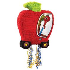 a red apple shaped pinata hanging from a string