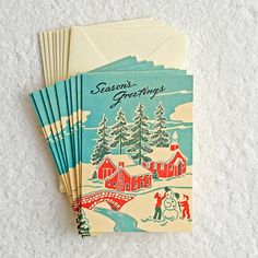 three christmas greeting cards sitting on top of each other