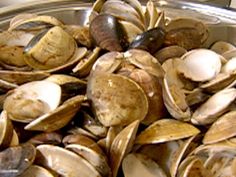 clams in a metal container on a table