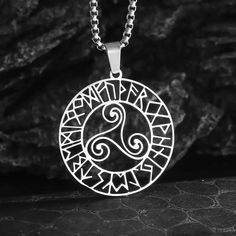 Immerse yourself in the mystical realms of Nordic and Celtic spirituality with our captivating Triangle Rune Spiral Necklace. Crafted from high-quality stainless steel, this stunning pendant features a harmonious blend of the triangle rune and the sacred spiral motif - both deeply rooted in pagan traditions. The triangle rune, also known as the Trine, is a powerful symbol representing the triad of the mind, body, and spirit, as well as the three realms of the physical, astral, and divine. Surrou Spiritual Stainless Steel Pendant Jewelry, Spiritual Stainless Steel Jewelry, Spiritual Stainless Steel Jewelry Round Shape, Spiritual Stainless Steel Nickel-free Jewelry, Spiritual Round Stainless Steel Necklace, Spiritual Round Stainless Steel Necklaces, Spiritual Stainless Steel Round Necklace, Handmade Viking Style Stainless Steel Jewelry, Viking Style Silver Stainless Steel Jewelry