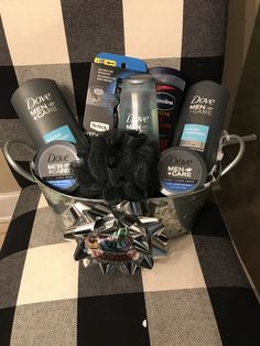 a metal bucket filled with men's grooming products on top of a checkered chair