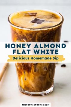 honey almond flat white drink in a glass with cinnamon sticks on the side and text overlay that reads, honey almond flat white delicious homemade sip