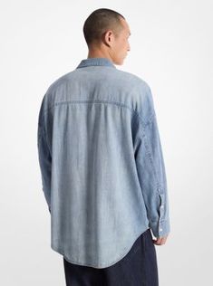 An essential addition to the season’s casual-cool wardrobe, this oversized take on the classic chambray shirt is as comfortable as it is versatile. Made from soft, breathable, 100% cotton, the button-up shirt features flap pockets, a drop shoulder and knuckle-grazing cuffs. The perfect way to lend a utilitarian edge to any look, it will work with everything from tailored separates to denim. Medium Wash Relaxed Fit Button-up Shirt, Relaxed Fit Shirt With Roll-up Sleeves For Daywear, Relaxed Fit Washed Tops For Daywear, Classic Oversized Tops With Button Closure, Casual Oversized Shacket With Patch Pockets, Classic Relaxed Fit Shacket With Button Closure, Oversized Casual Shirt With Patch Pockets, Classic Shacket With Button Closure And Relaxed Fit, Casual Light Wash Shacket For Spring