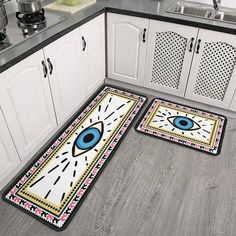 two rugs with an eye on them in the kitchen