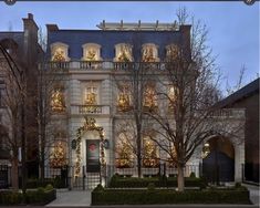 a large house with christmas lights on the windows