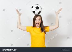 a woman with her hands up and a soccer ball on her head over her head