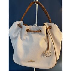 Nwt Michael Kors Canvas Montauk Tote Bag. The Perfect Summer Bag- Cream Canvas With Tan Leather Braided Handles Interior Trim And A Leather Bottom. Gold Hardware And Gold Mk Hangtag. Measures 18” Across The Center, 11” Tall, Strap Drop Is 6 1/4”. No Stains Or Tears. From A Smoke Free Home. Please Ask Any And All Questions Prior To Purchase. Cream Canvas Bag With Gold-tone Hardware, Cream Canvas Bags With Gold-tone Hardware, Everyday Michael Kors Bags With Leather Trim, Michael Kors Tote Bag With Leather Trim, Michael Kors Leather Trim Tote Bag, Michael Kors Beige Bags With Leather Trim, Michael Kors Bags With Leather Trim For Daily Use, Everyday Michael Kors Canvas Bag, Casual Michael Kors Shoulder Bag For Errands