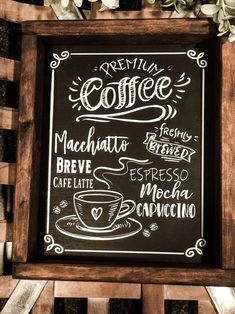 a chalkboard sign with coffee written on it