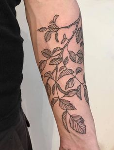 a person with a tattoo on their arm