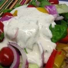 a colorful salad with dressing on it