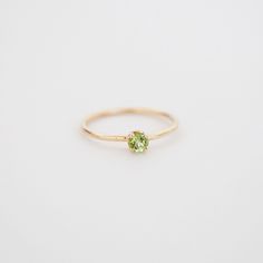 Birthstones never get old. The Peridot Birthstone Ring has a 14k solid yellow gold band that’s durable and waterproof. Natural peridot from China gives a beautiful sparkle. Details Bright green natural peridot 14k solid yellow gold—durable, waterproof, and low-maintenance, making it the ultimate everyday ring 1.6 mm thick band with an approximately 4mm stone AA Grade Origin: China Enhancements: none Gold weighs 1 gram depending on size Made to order. Please allow an additional week on top of our Peridot Ring Gold, Peridot Birthstone Ring, Birthstone Jewelry Mothers, August Birthstone Ring, Peridot Birthstone, China Shop, Everyday Ring, August Birthstone Jewelry, August Birthstone