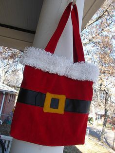 a santa claus bag hanging from the side of a house