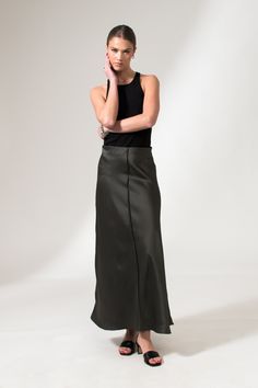 The Alicia Skirt is a flared fit, floor length skirt, crafted from a fine satin. This fluid skirt has an A-Line shape, an easy pull-on style, and an effortlessly elevated finish with French seams and visible front hem detail. This sustainable skirt is tailor made and on demand. It takes us 3 hours to make this skirt. PLEASE ALLOW 1-5 BUSINESS DAYS FOR PRODUCTION Relaxed Fit Satin Maxi Skirt, Silk Solid Color Flared Maxi Skirt, Sleek Long Bias Cut Skirt, Silk Maxi Skirt With Relaxed Fit, Flowy Wide Leg Skirt With Bias Cut, Sleek Long Maxi Skirt For Spring, Sleek Long Lined Skirt, Relaxed Bias Cut Satin Maxi Skirt, Silk Satin Finish Flowy Maxi Skirt