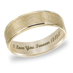 a wedding band with the words i love you forever engraved on it in yellow gold