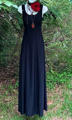 Black witchy Dress A beautiful vintage black maxi dress Empire line with long floaty skirt Stretchy polyester Sleeveless Size approx a xs Bust best fits busts of 32-34 inches High waist 26 inches Length Shoulder to hem- 60 inches Bohemian A-line Maxi Dress For Evening, Black Bohemian Maxi Dress For Night Out, Black Gothic Maxi Dress For Summer, Gothic Maxi Dress For Party, Fitted Gothic Maxi Dress, Black Sleeveless Gothic Maxi Dress, Fitted Gothic Floor-length Maxi Dress, Black Bohemian Evening Maxi Dress, Black Bohemian Maxi Dress For Evening