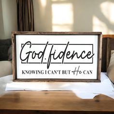 a sign that says god's evidence is on the table in front of a couch