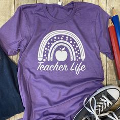 **Last Day or Order for Christmas: Nov 30th Every teacher should have at least one shirt in their closet that helps them to feel proud of their profession! This teacher life shirt will do just that. This graphic tee has a classic look to it and makes a great shirt for any teacher, great for casual work days. Also would make a great gift for any teacher in your life. This short sleeve shirt comes with nursing design in white across the front of the shirt using a screen printed transfer. Short Sle Nursing Design, Teacher Themes, Grafic Tees, Funny T Shirt Sayings, Nurse Design, Tee Designs, Personalized Teacher Gifts, T Shirt Image, Teacher Style