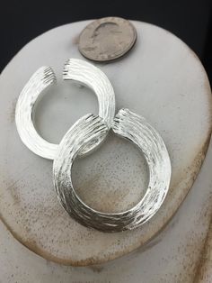 "At about 1.25 inches in diameter, I've hand-forged a sterling silver Enso pendant, a popular symbol for Zen Buddhism, represents a depiction of the classical ... One breath, One brush stroke, One mind As each one is hand-fabricated individually by me at my bench studio and each will have minute differences as these are never cast pieces, but forged from the concept of the Enso belief and meaning. This piece is hand-forged in sterling silver and weighs substantially, meaning this is solid throug Hand Cast Minimalist Round Jewelry, Minimalist Hand Cast Round Jewelry, Minimalist Hand Cast Jewelry With Round Pendant, Nickel Free Silver Round Pendant Jewelry, Nickel-free Silver Round Pendant Jewelry, Hand Forged Silver Jewelry, Silver Nickel Free Round Pendant Jewelry, Silver Open Circle Jewelry For Anniversary, Hammered Sterling Silver Round Pendant Jewelry