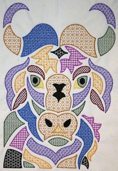 a cross stitch pattern with an animal's head in the center, on a white background