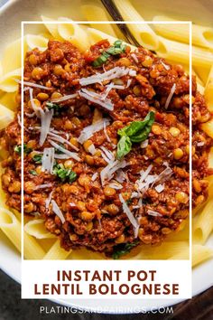 instant pot lentil bolognzoe with parmesan cheese on top in a white bowl