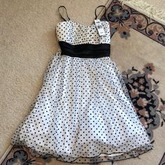 Nwt Trixxi Brand Black & White Polka Dot Spaghetti Strap Dress In Juniors Size Medium. This Is A Gorgeous Fit & Flare Style Dress That Is Excellent Quality - Triple Lining With A Mesh/Satin White Layer, Satin White Layer, And Finally The Polka Dot Mesh. Padded Layer In The Chest Area. Adjustable Black Spaghetti Straps. Original Price - $59. Comes From A Smoke Free, Pet Free Home. Elegant Polka Dot Dress With Spaghetti Straps, Fitted Polka Dot Dress With Spaghetti Straps, Summer Polka Dot Dress With Sweetheart Neckline, Elegant Strapless Polka Dot Dress, Trixxi Dress, Black Spaghetti Strap, Strap Dress, Spaghetti Strap Dresses, White Polka Dot