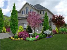 a large house with lots of flowers in the front yard