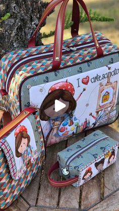 an image of children's luggage set on a tree stump