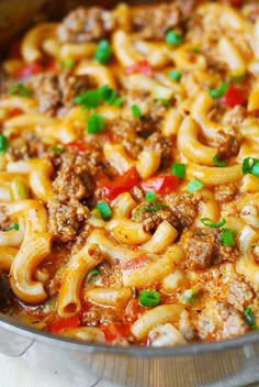 a large pot filled with pasta and meat