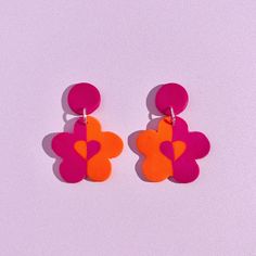 Bright orange and hot pink colour way, handmade flower earrings with butterfly push back stud posts. They have a heart pattern in the centre which is inverted colours which looks so cool! All handmade with love by me! ITEM DETAILS ✿ All my items are made by hand and made to order so can take 1-4 days to make, package and post ✿ All of my items are made by hand so there will be only a slight vary in exact colour, shape and pattern as each one is unique and different in their own way! However i tr 70s Clay Earrings, Handmade Retro Orange Earrings, Groovy Polymer Clay Earrings, Handmade Funky Yellow Earrings, Multicolor Flower-shaped Artsy Earrings, Invert Colors, Unusual Earrings, Flower Studs, Heart Patterns