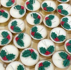 cupcakes decorated with holly leaves and red berries