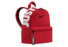 Nike Brasilia JDI Boys /Girls Mini BackPack The Nike Brasilia JDI unisex mini BackPack is small but convenient. Made from recycled polyester fabric featuring adjustable Padded shoulder straps, this BackPack has a Just Do It keychain and screen print for some seriously cool vibes. A double-zippered main compartment offers plenty of room, while the smaller front pocket keeps items like your wallet and keys easily within reach. Made with at least 20% recycled content by weight. Move to Red Nike School Bag, Nike Red Travel Bag, Red Nike Travel Bag, Cool Vibes, Backpack Reviews, Rack Room, Rack Room Shoes, Recycled Polyester Fabric, Red Nike