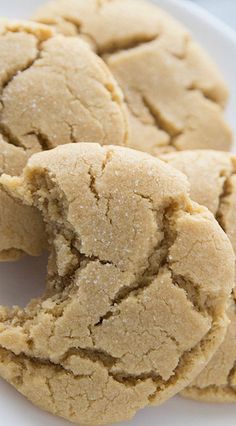 some cookies are on a white plate and have been cut in half to show the inside