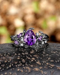 ► FEATURES Engagement ring set: Center Stone: 1.0Ct Amethyst Size: 6X8mm Pear Cut Side Stone: Moissanite & Amethyst Band Width: 1.6-1.7mm Wedding Band: Moissanite & Amethyst Band Width: 1.6-1.7mm *Metal: The base metal is sterling silver/10k white gold/14k white gold/18k white gold, coated with black rhodium The center stone of the ring can be replaced with other different kinds of gemstone such as morganite, aquamarine, amethyst, citrine, opal, moissanite, alexandrite, moss agate, etc. If you w Engagement Ring With Black Band, Wedding Rings Amethyst, Gold Wedding Rings For Women, Black Gold Wedding Rings, Black Gold Wedding, Amethyst Engagement Ring, Amethyst Ring Engagement, Cute Engagement Rings, Promise Ring Gift