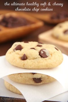 two chocolate chip cookies sitting on top of each other